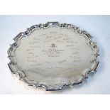 Military Interest: A large silver salver with pie-crust rim and three hoof feet engraved in