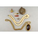 A mixed lot containing white glass beads, perfume bottle, plated mirror,