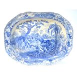 An early 19th century Spode blue and white transfer meat plate with gravy well,