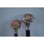 A walking cane with carved and polished marbled hardstone skull pommel,