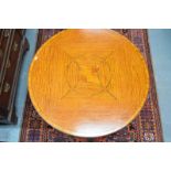An Edwardian inlaid satinwood Sheraton revival occasional table, the quadrant-veneered circular