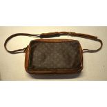 A Louis Vuitton vintage shoulder bag in tan and darker brown textured leather with 'LV' monogram and