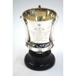 Military interest: a silver thistle-shaped trophy-cup with three flattened strap handles engraved '