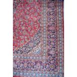 A Persian Meshad carpet, the ivory and blue central medallion with conforming spandrels and