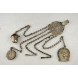 An Edwardian metal chatelaine having dance card, pin cushion and thimble case attached