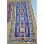 A Caucasian Kazak design rug, Azarbayejan, blue ground,