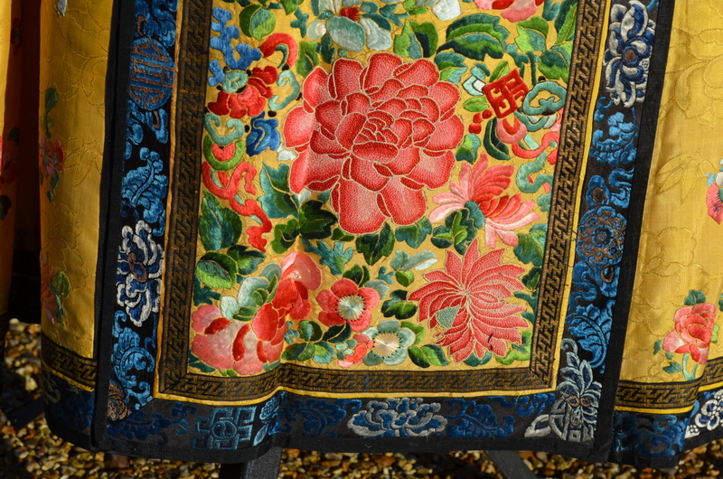 A Chinese imperial-yellow ground textile skirt decorated with floral designs, - Image 2 of 5