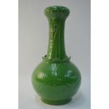 A Chinese green monochrome vase with lotus design,