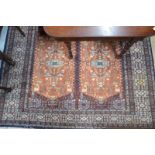 An Indo-Persian Ersari Turkoman design carpet, with four large terracotta medallions on brown ground