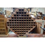 An octagonal teak set of eighty-four numbered pigeonholes with ivorine labels (traditionally used