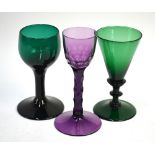 Two 19th century green drinking glasses, one with a conical bowl, bladed knop stem, conical foot and