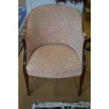 A Howard & Sons mahogany framed tub chair in the Georgian manner, with padded back and stuff over