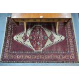 Indo Persian rug, with central medallion on cream ground and red field with flower head