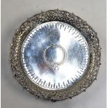 A Victorian silver visiting card salver with engraved decoration within pierced rim and foliate