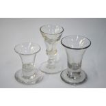 Two 18th century dram glasses, each with drawn trumpets bowls and firing feet, 9.3 & 7.5 cm high