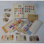 An album of Victorian and later British, Empire and foreign postage stamps to/w a quantity of