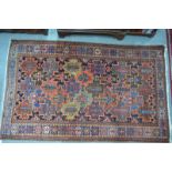 A Persian Bakhtiari rug, South Persia, multi-coloured geometric design within repeating guarded