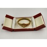 AMENDED ESTIMATE A Victorian bloomed unmarked gold diamond set bangle,