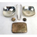 An engraved silver hip-pocket cigarette case, Birmingham 1923, to/w two Sterling pin-dishes set with