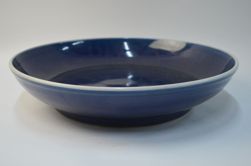 A large Chinese blue monochrome circular dish with unglazed base, 34 cm diameter, - Image 2 of 4