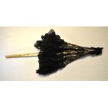 A black Chantilly lace parasol with foliate and carved ivory shaft and ferrule, three finely
