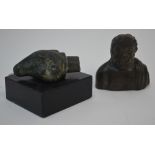 An antiquity bronze ram's head finial, 5.5 cm long overall, on wood base, to/w a small cast