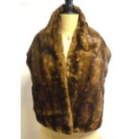 A shadowed mid-brown mink stole, a taupe fox fur collar, a black fox fur collar, a fox fur muff,