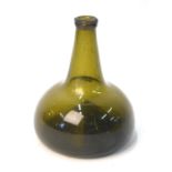 An early 18th century onion shaped green glass bottle, the flattened body with a kicked-in base,