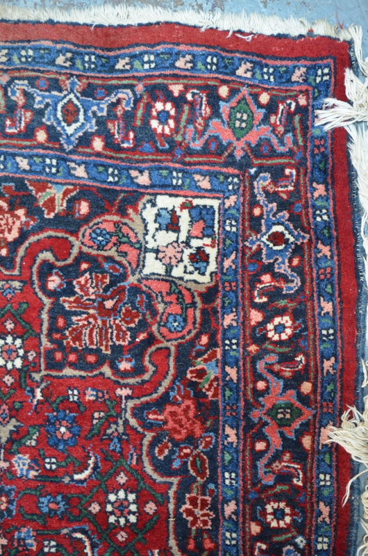 A fine Persian Bidjar rug with large central floral motif on red ground within multi-borders, - Image 2 of 3