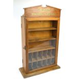 An early 20th century oak counter top shop display cabinet for Cash's Washing Ribbons,
