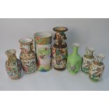 Seven Chinese famille rose vases, including: a Canton famille rose bitong, or other vessel,