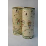 A pair of Japanese vases of cylindrical form, each one decorated in enamels, 30 cm high,
