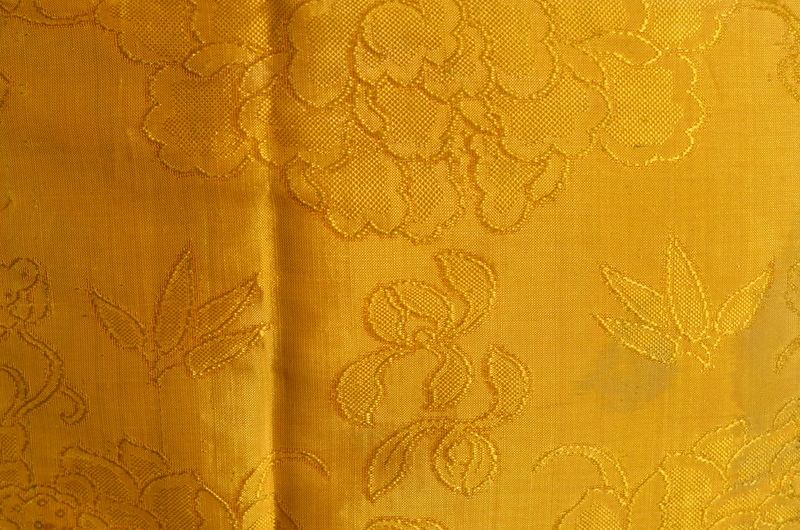 A Chinese imperial-yellow ground textile skirt decorated with floral designs, - Image 3 of 5