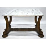 A Regency style carved giltwood centre table, the veined white marble top with all-round moulded