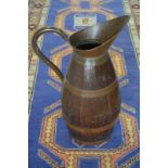 A coopered copper and oak large beer-jug (used as stick-stand),