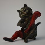 After Bergmann - cold-painted bronze figure of Puss in Boots, seated, polishing his boot, 7.