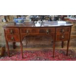 A Regency mahogany and rosewood cross-banded bowfront sideboard with central frieze drawer flanked