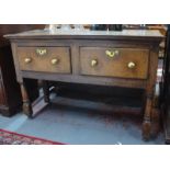 A late 17th century joint oak side table, with pair of deep frieze drawers raised on turned legs, 76