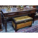 A Victorian oak side table with three frieze drawers, on octagonal tapering supports, label on