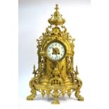 A large and ornate cast brass mantle clock with eight-day Japy Freres movement