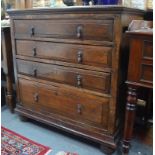 An oak chest of four long drawers, of 17th century origin, on bun feet, 86 cm wide