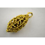 An 18ct yellow gold textured pierced pendant enclosing quartz beads,