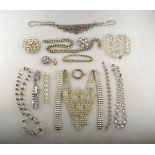 A collection of vintage jewellery including white paste necklaces, brooches to/w two rows of