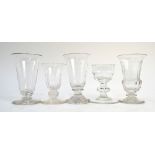 A collection of four jelly glasses and a