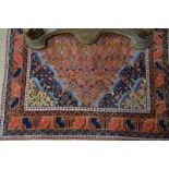 A Persian Ardebil rug, the terracotta gr
