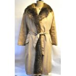 A cream fur-lined coat with tie-belt, 52