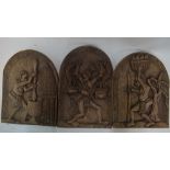 Three African carved wood wall-masks, to