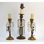 A pair of Regency style parcel gilt bron