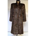 A mid-brown squirrel fur coat retailed by Tyrrell & Green, Southampton, 50 cm across chest,