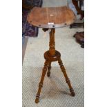 An Arts & Crafts period oak tripod campaign shaving table,